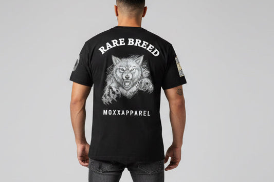 Black t-shirt with a wolf graphic and 'Rare Breed' text on a white background